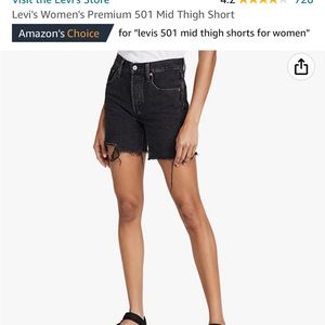 Black Levi’s, mid-thigh shorts
